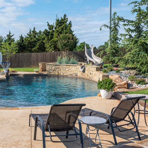 OKC Residential Landscaping For Pool Area. Patio Furniture including Chaise Lounger / Sun Lounger