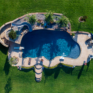 Aerial View of Residential Resort-style Pool With Slide. Landscaping and Stonescaping by Perimeter Landscape OKC.